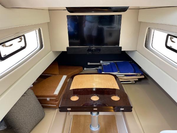 Slide: The Image of Interior of 2020 Scout 420 LXF yacht with TV and seating area. - 29