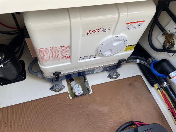 Slide: The Image of 2020 Scout 420 LXF boat engine compartment with equipment and wiring. - 30