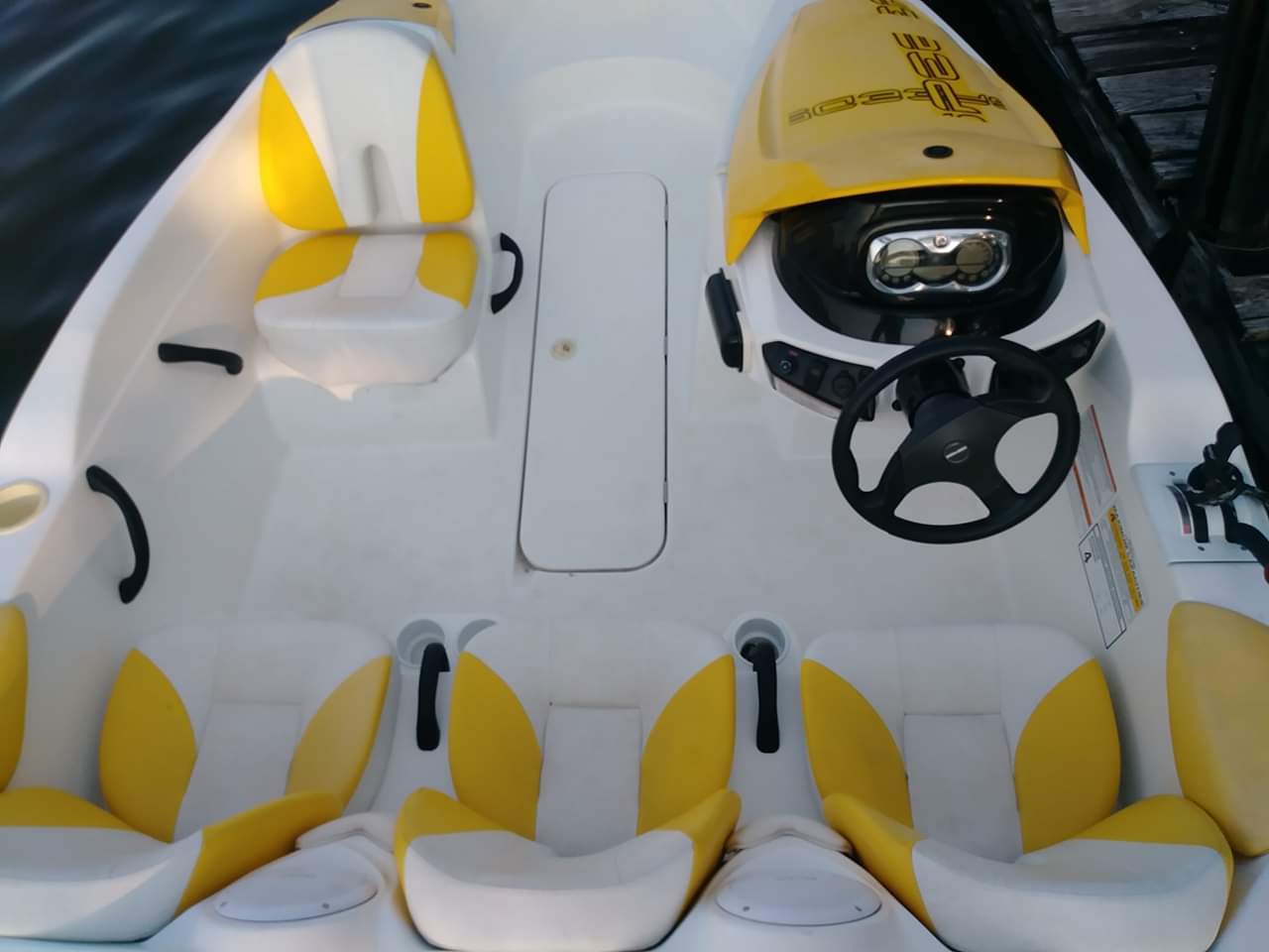 Slide: The Image of 2010 Sea-Doo 150 Speedster interior with yellow and white seating. - 21