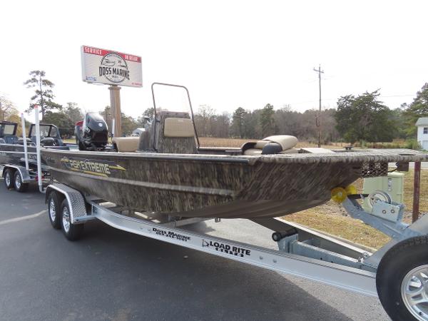 Slide: The Image of 2025 SeaArk 2072 FXT boat on Load Rite trailer at Doss Marine dealership. - 0