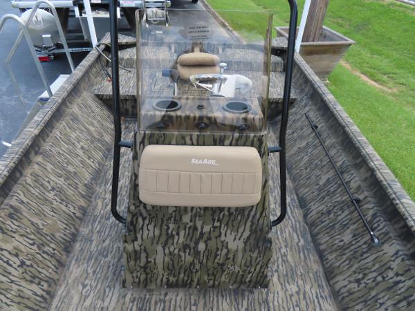 Slide: The Image of 2025 SeaArk 2072 FXT boat with camouflage design and central console. - 1