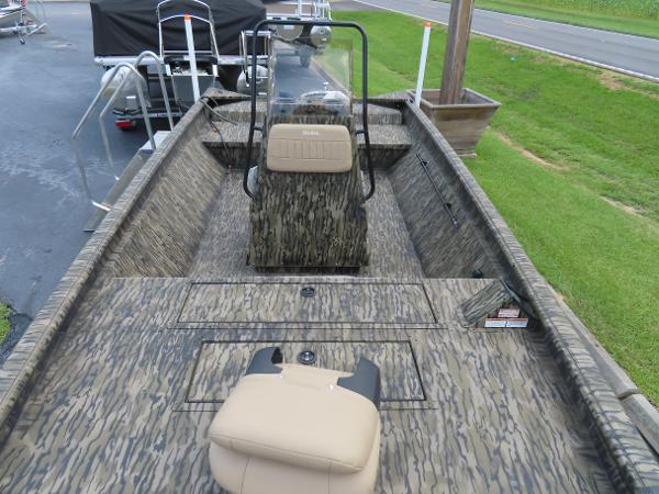 Slide: The Image of 2025 SeaArk 2072 FXT boat with camouflage design and beige seating. - 10