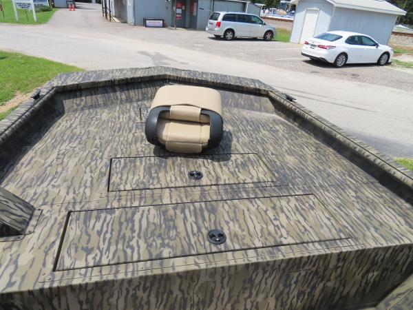 Slide: The Image of 2025 SeaArk 2072 FXT boat with camo pattern and foldable seat. - 14