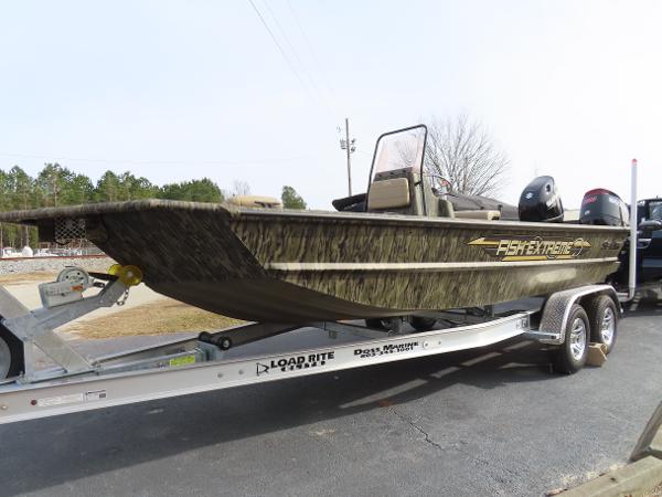 Slide: The Image of 2025 SeaArk 2072 FXT fishing boat on Load Rite trailer, side view. - 20