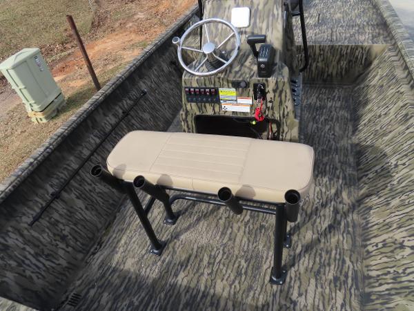 Slide: The Image of 2025 SeaArk 2072 FXT boat interior with steering console and bench seat. - 24