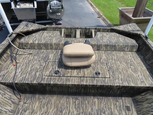 Slide: The Image of 2025 SeaArk 2072 FXT boat with camouflage pattern and beige seat. - 4