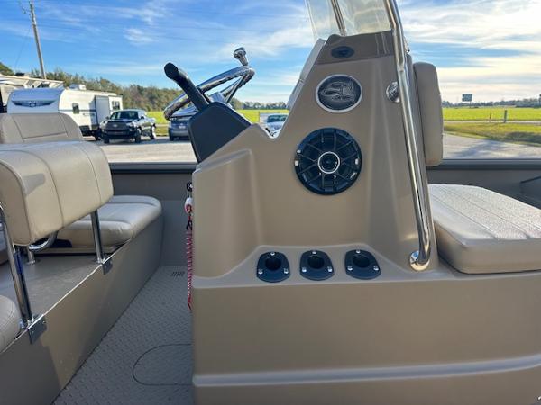 Slide: The Image of 2024 SeaArk 2072 VFX Elite CC boat interior with steering console and seating. - 10