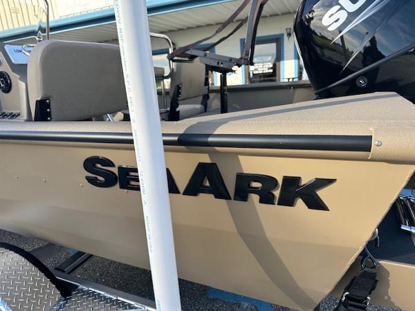 Slide: The Image of 2024 SeaArk 2072 VFX Elite CC boat side view with logo and interior seats. - 2