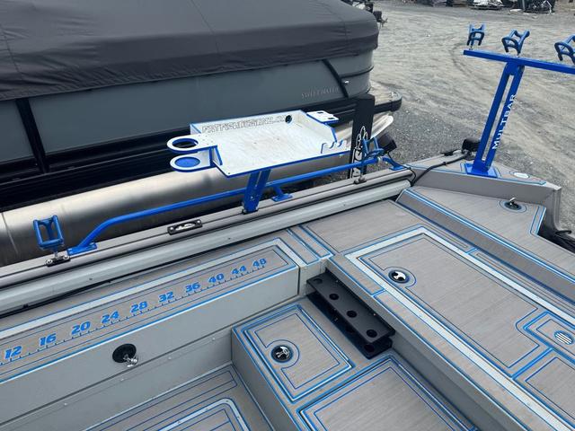 Slide: The Image of 2023 SeaArk Pro Cat 240 boat deck with blue accents and measurement markings. - 7