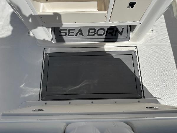 Slide: The Image of 2024 Sea Born FX25 Bay boat interior with storage compartments. - 30