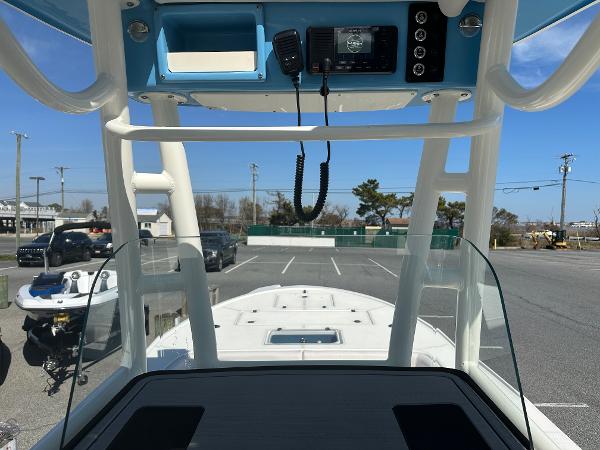 Slide: The Image of 2024 Sea Born FX25 Bay boat console with electronics and clear windshield. - 36