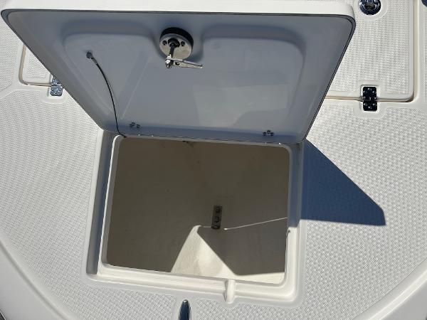 Slide: The Image of 2024 Sea Born FX25 Bay boat storage compartment with open hatch. - 9