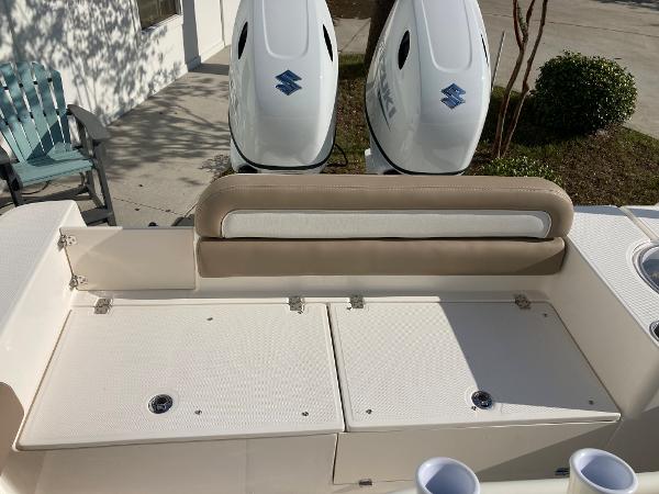 Slide: The Image of 2024 Sea Born LX24 boat with dual Suzuki outboard motors and rear seating. - 1