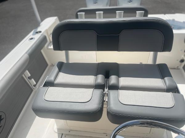 Slide: The Image of 2024 Sea Born LX 24 boat seating and console area. - 11