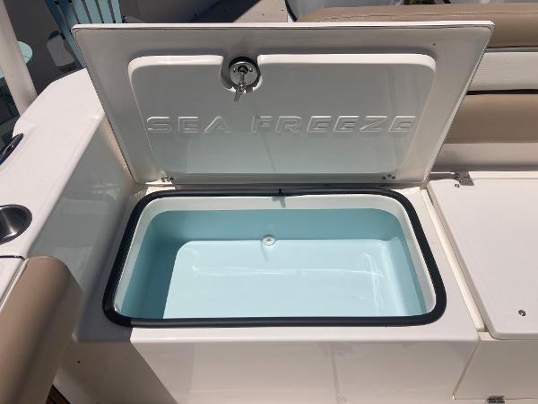 Slide: The Image of 2024 Sea Born LX24 boat with open Sea Freeze compartment. - 4