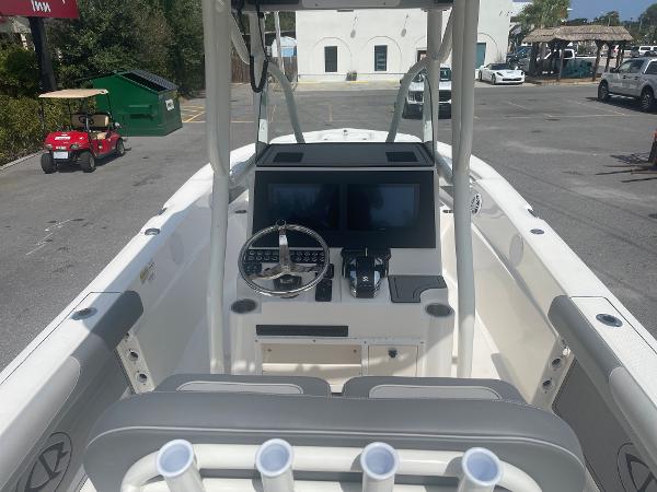Slide: The Image of 2024 Sea Born LX 24 boat dashboard with dual screens and steering wheel. - 5