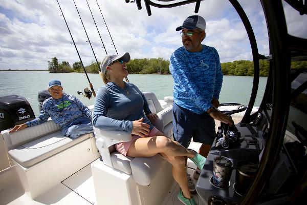 Slide: The Image of People enjoying a day on a 2023 Sea Born LX26 boat. - 11