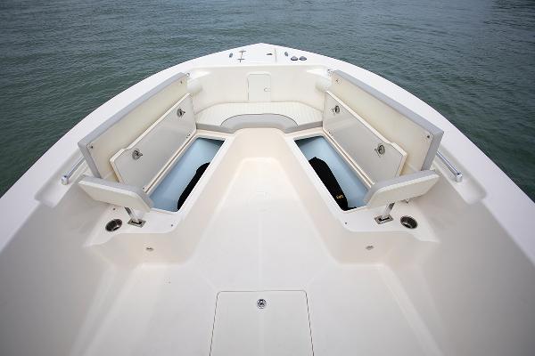 Slide: The Image of 2023 Sea Born LX26 boat bow with open storage compartments. - 21
