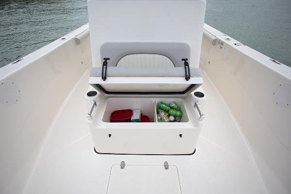 Slide: The Image of 2023 Sea Born LX26 boat with open storage compartment and beverages. - 22