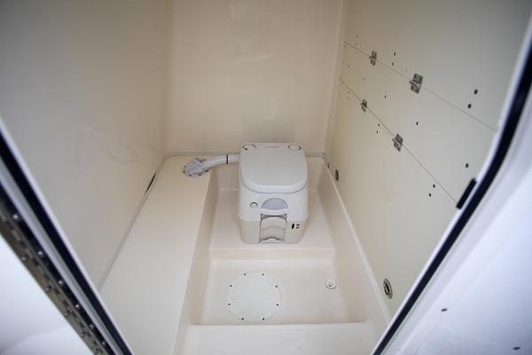 Slide: The Image of 2023 Sea Born LX26 boat interior with compact marine toilet. - 27