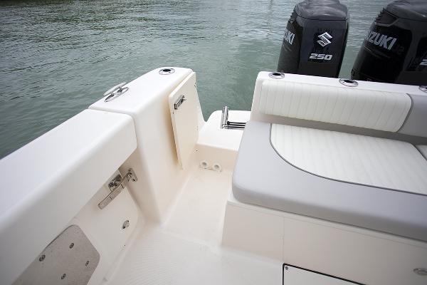 Slide: The Image of 2023 Sea Born LX26 boat with Suzuki 250 engines, featuring a white and gray seating area. - 30