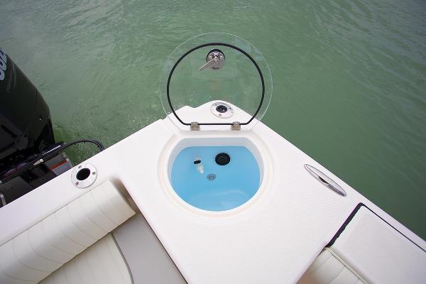 Slide: The Image of 2023 Sea Born LX26 boat with open livewell on deck. - 6