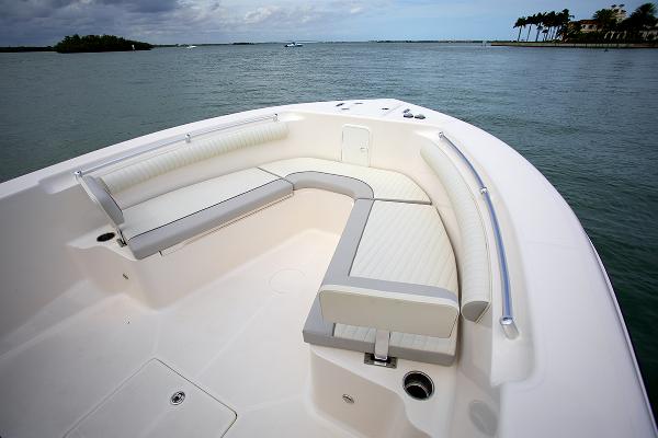 Slide: The Image of 2023 Sea Born LX26 boat with spacious seating area on calm waters. - 9