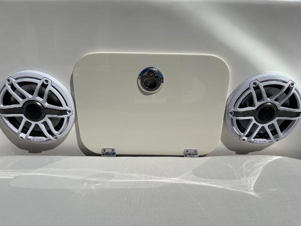 Slide: The Image of 2024 Sea Born LX 26 boat speakers and storage compartment. - 10