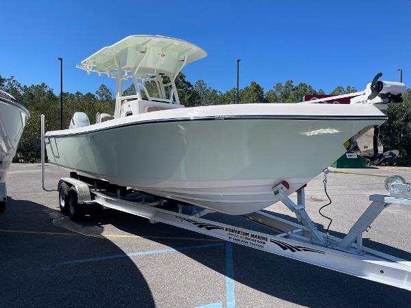 Slide: The Image of 2024 Sea Born LX 26 boat on trailer in parking lot. - 2