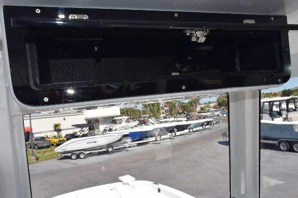 Slide: The Image of Interior view of 2025 Sea Cat 26 Hybrid Catamaran with open storage compartment. - 12