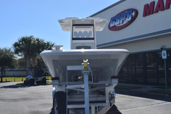 Slide: The Image of 2025 Sea Cat 26 Hybrid Catamaran on trailer outside dealership. - 2
