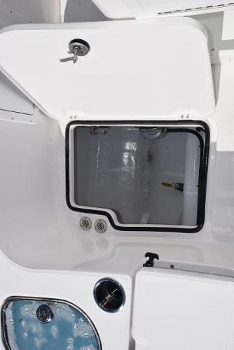 Slide: The Image of 2025 Sea Cat 26 Hybrid Catamaran storage compartment with open hatch. - 21