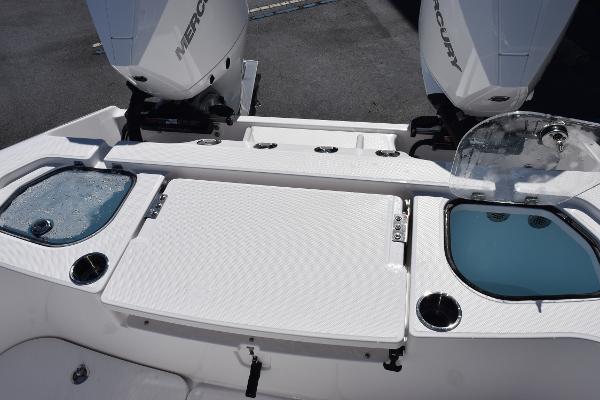 Slide: The Image of 2025 Sea Cat 26 Hybrid Catamaran with dual Mercury engines and live wells. - 23