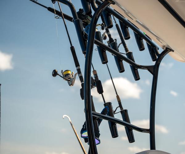 Slide: The Image of Fishing rods on a 2025 Sea Cat 26 Hybrid Catamaran against a clear sky. - 5
