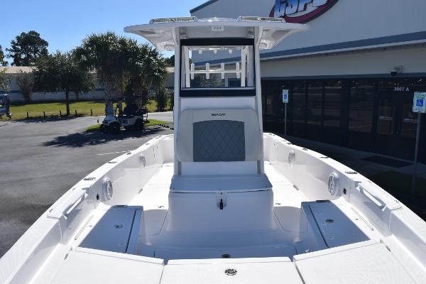 Slide: The Image of 2025 Sea Cat 26 Hybrid Catamaran, spacious deck view, parked outdoors. - 7