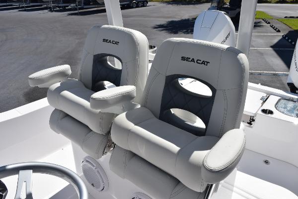 Slide: The Image of 2025 Sea Cat 26 Hybrid Catamaran with plush white seating and modern design. - 8