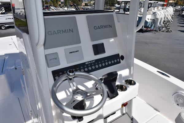 Slide: The Image of 2025 Sea Cat 26 Hybrid Catamaran helm with Garmin navigation system. - 9