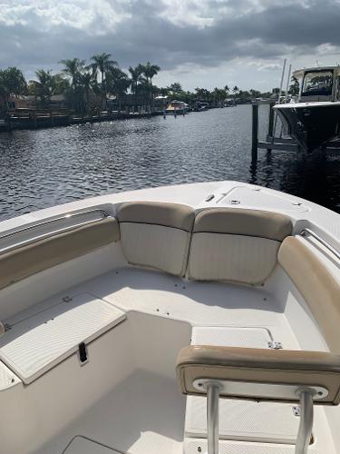Slide: The Image of 2017 Sea Fox 226 Commander boat on a calm waterway with palm trees. - 4
