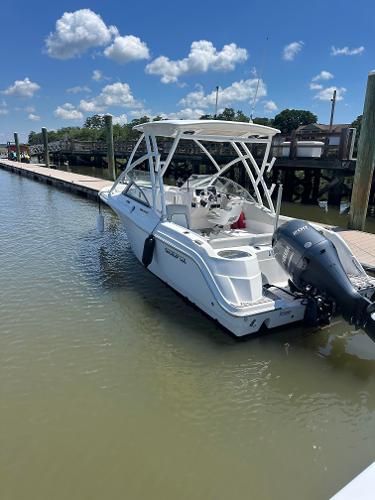 Slide: The Image of 2024 Sea Fox 226 Traveler boat docked on a sunny day. - 15