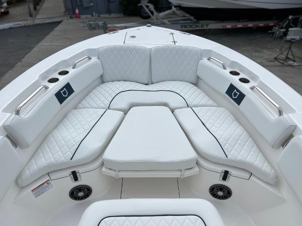 Slide: The Image of 2024 Sea Fox 228 Commander boat with white cushioned seating. - 10