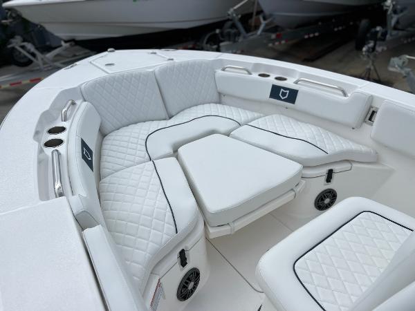 Slide: The Image of 2024 Sea Fox 228 Commander boat with luxurious white seating and cup holders. - 13