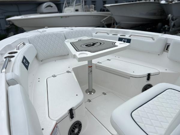 Slide: The Image of 2024 Sea Fox 228 Commander boat interior with seating and table. - 14