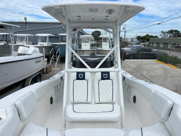 Slide: The Image of 2024 Sea Fox 228 Commander boat with white seating and T-top. - 16