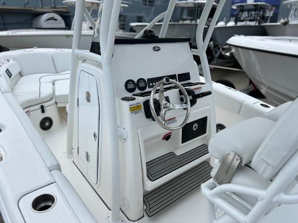 Slide: The Image of 2024 Sea Fox 228 Commander boat interior with steering console and seating. - 18