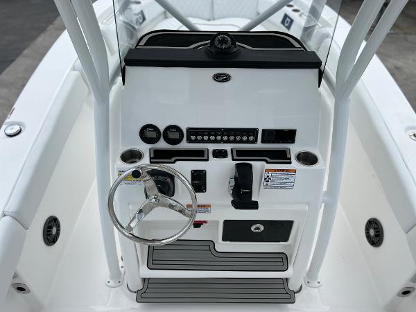 Slide: The Image of 2024 Sea Fox 228 Commander boat console with steering wheel and controls. - 19