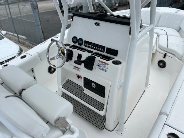 Slide: The Image of 2024 Sea Fox 228 Commander boat console with steering wheel and controls. - 20