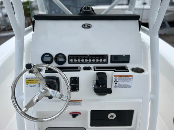 Slide: The Image of 2024 Sea Fox 228 Commander boat console with steering wheel and controls. - 21