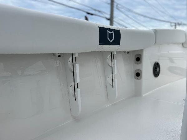 Slide: The Image of 2024 Sea Fox 228 Commander boat interior detail with white cushioned seating. - 23