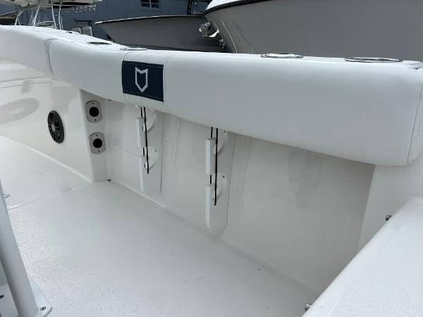 Slide: The Image of 2024 Sea Fox 228 Commander boat interior with white seating and storage compartments. - 24