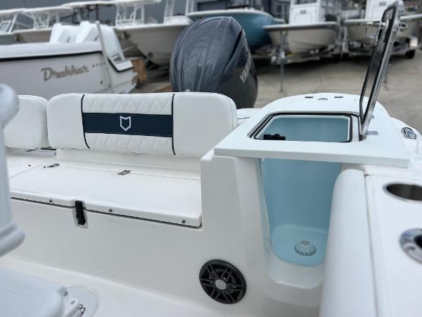 Slide: The Image of 2024 Sea Fox 228 Commander boat interior with seating and storage compartments. - 25